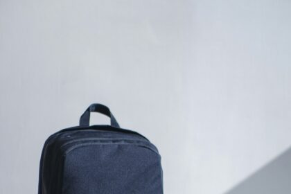 Neatly packed open suitcase with travel capsule wardrobe
