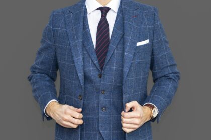 Woman in tailored blazer and trousers styled for evening out