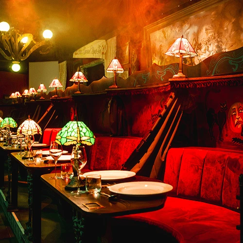 Guests enjoying the Chat Noir immersive 1890s Paris cabaret experience in London