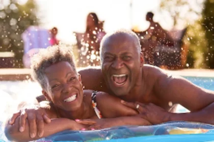 Couple in a pool enjoying a worry-free insured holiday