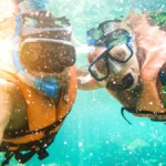 Couple taking a selfie in a tropical sea on holiday