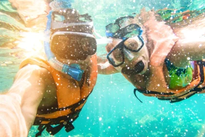 Couple taking a selfie in a tropical sea on holiday