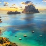 Cala d'Hort bay with Es Vedrà rock, Ibiza - Mediterranean ferry routes with Ferryhopper