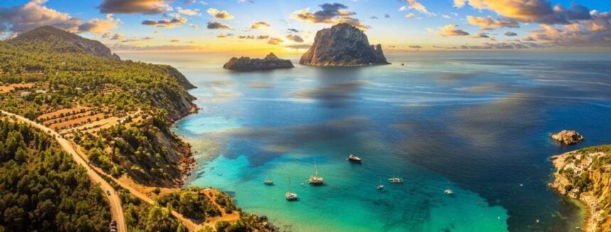 Cala d'Hort bay with Es Vedrà rock, Ibiza - Mediterranean ferry routes with Ferryhopper