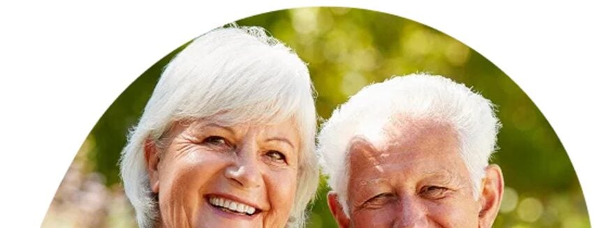 Over-70s couple enjoying a holiday with travel insurance