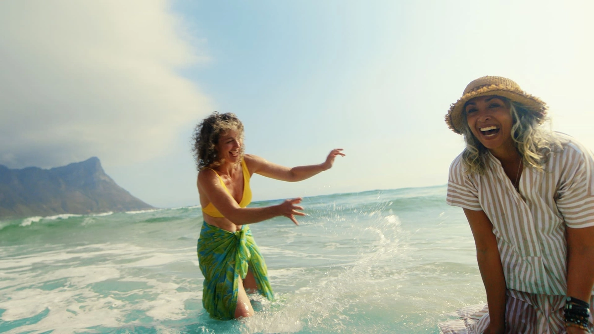Woman enjoying a holiday at sea with the peace of mind that Staysure travel insurance provides
