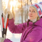 Skier on a snowy slope with winter sports travel insurance