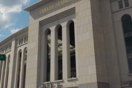 The exterior facade of Yankee Stadium in the Bronx on a summer day