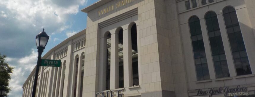 The exterior facade of Yankee Stadium in the Bronx on a summer day