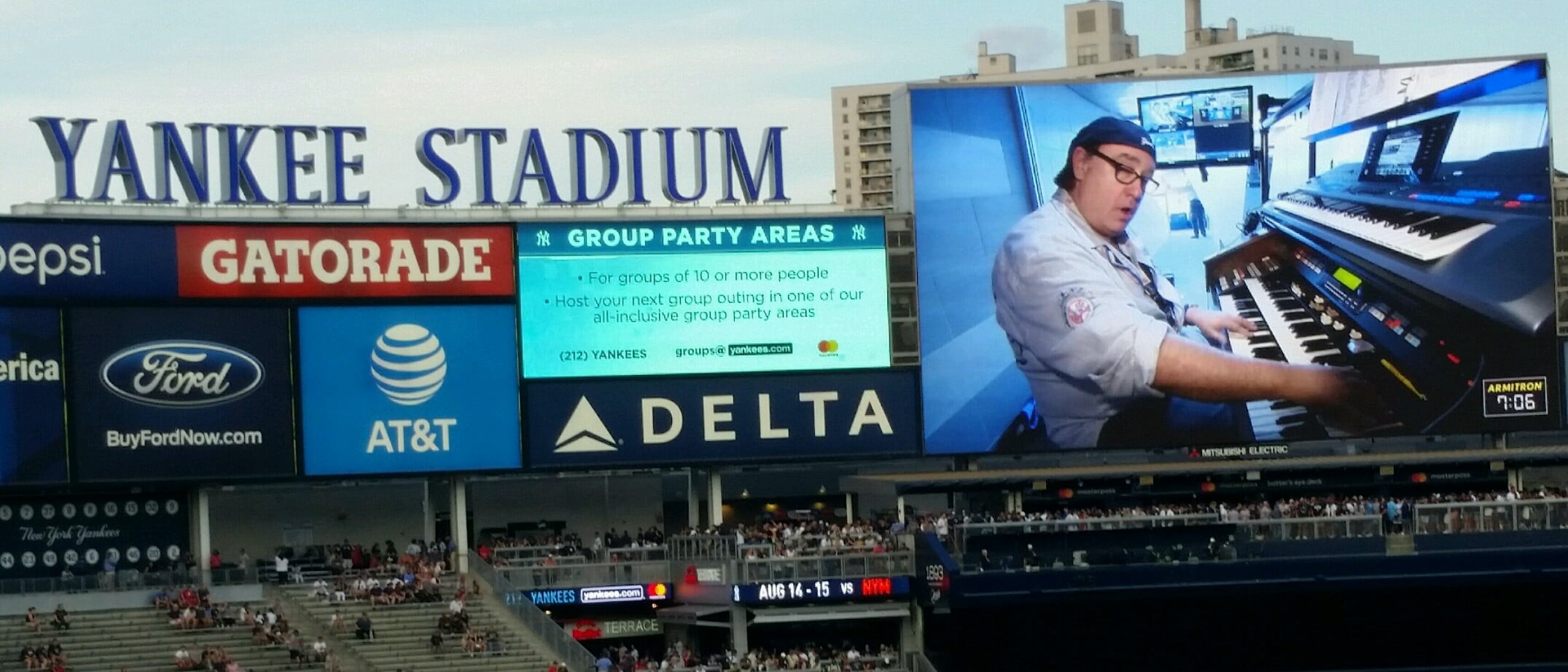 The large video scoreboard above the outfield bleachers at Yankee Stadium