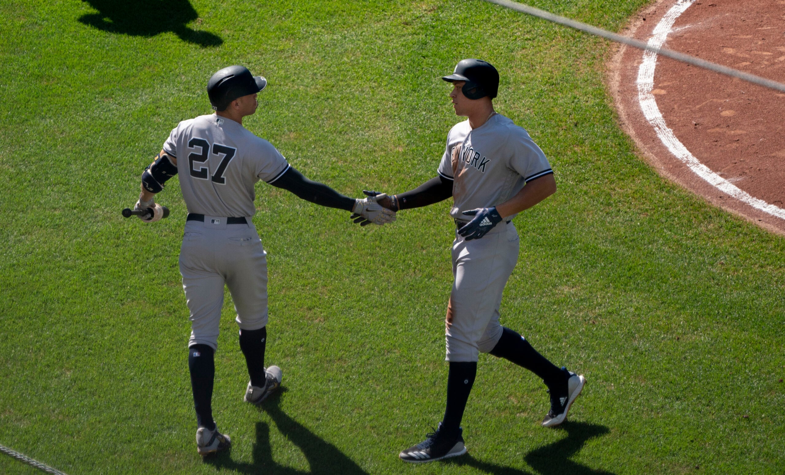 New York Yankees sluggers in pinstriped home uniforms on the field