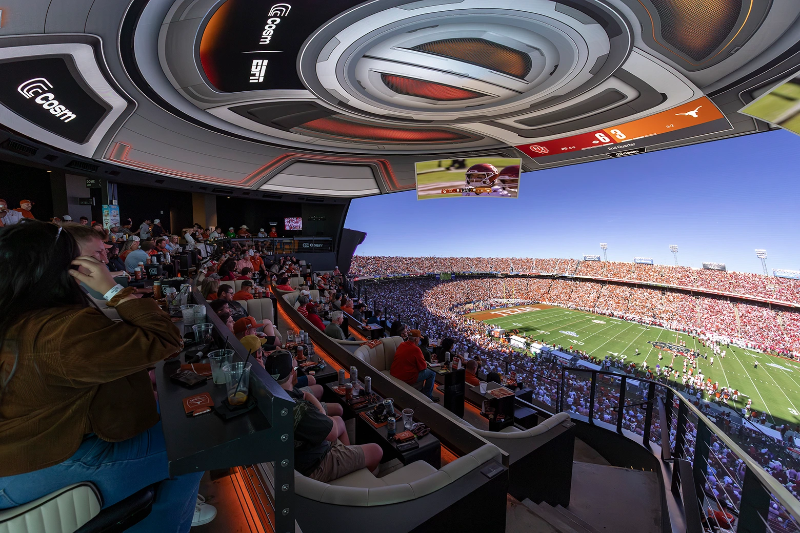 Fans in loge-style reserved seating under the Shared Reality dome at Cosm on a big match day