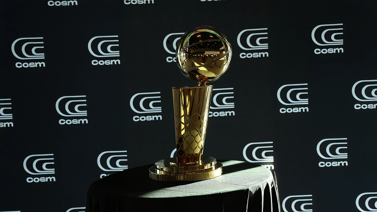 The Larry O'Brien NBA championship trophy on display at a Cosm venue