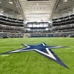 Interior view of AT&T Stadium with the football field and seating bowl
