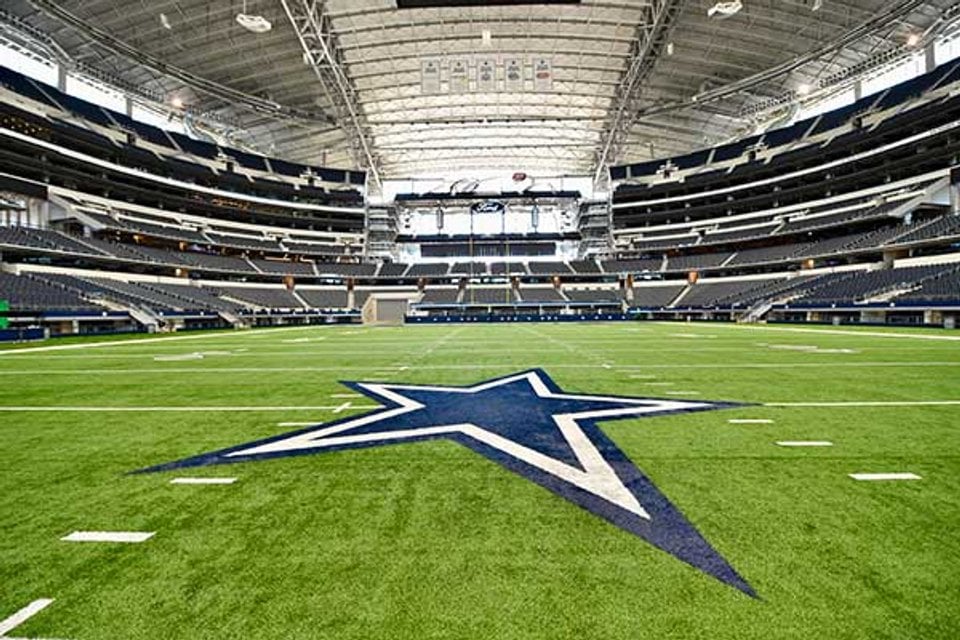 Interior view of AT&T Stadium with the football field and seating bowl