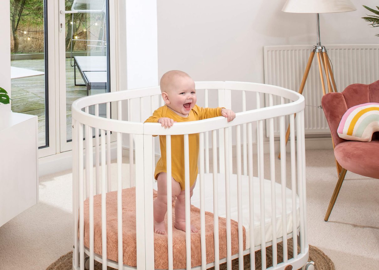Boori Oasis Oval Cot styled in a bright nursery