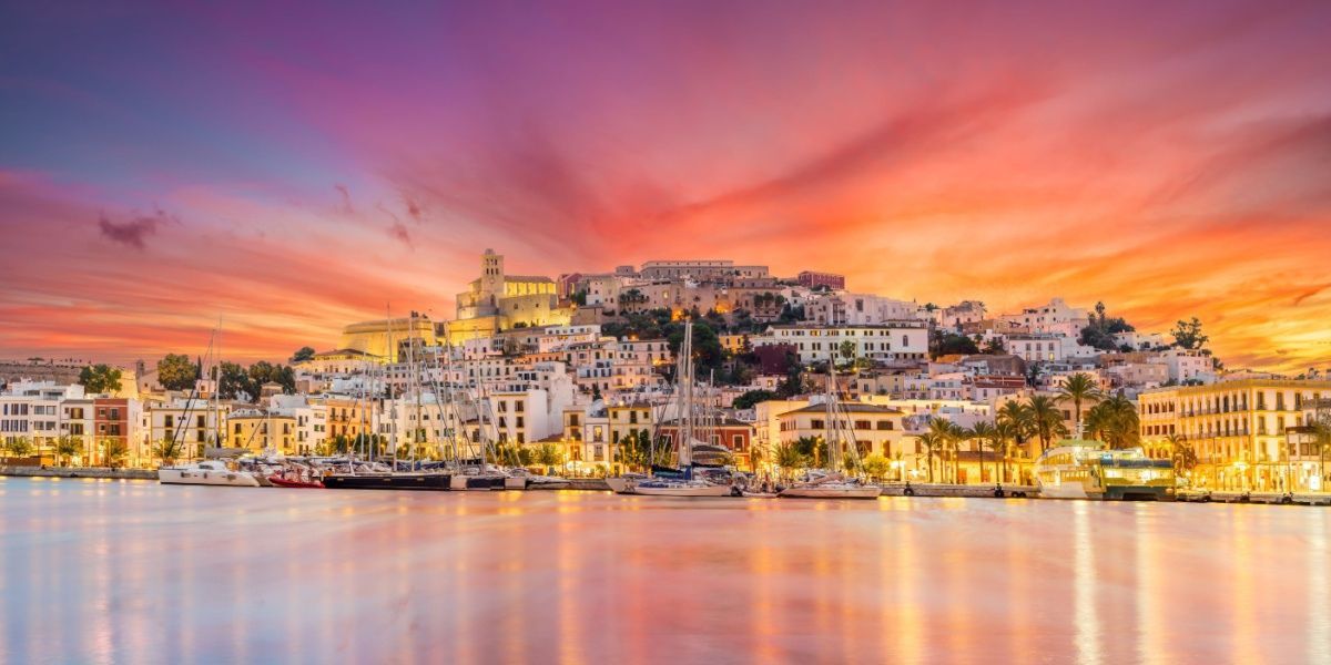 Ibiza town and harbour at twilight from the water