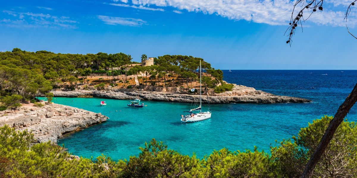 Boats in a bright bay near Mallorca in the Balearic Islands