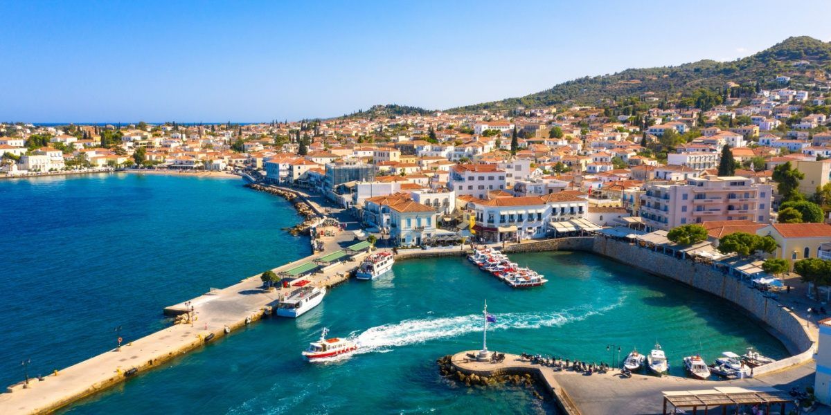 Spetses island town and port beside clear water