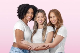Three women embracing in a bright Happy V wellness lifestyle photograph
