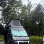 Camper van in a forest campsite