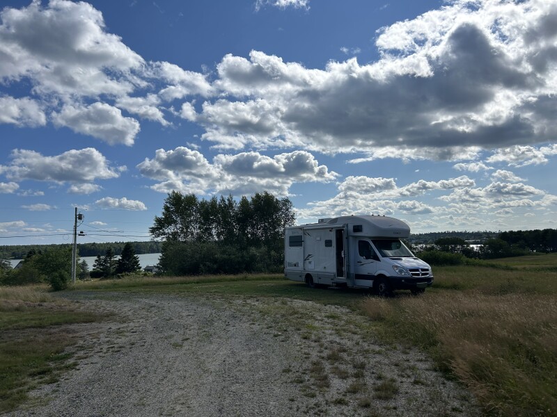 RV near a lakeside field