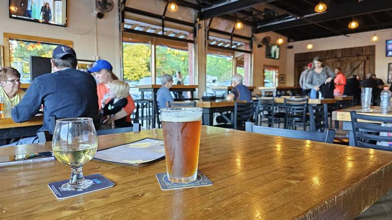 Beer and wine on a table in a brewery dining room