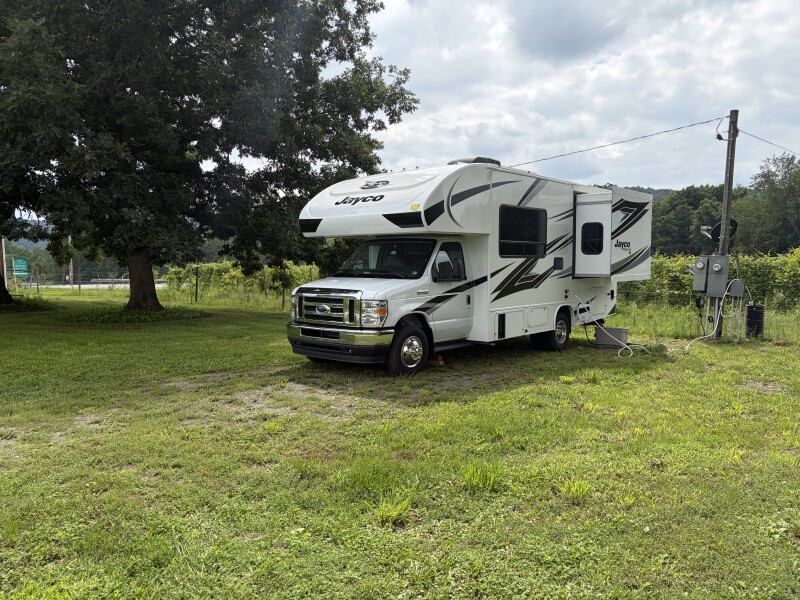RV parked beside a vineyard