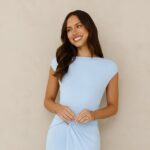 Model wearing a blue wrap-detail maxi dress