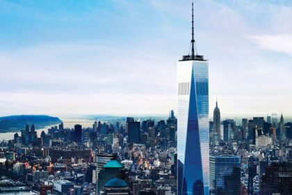 Wide aerial view of One World Trade Center and Lower Manhattan from above