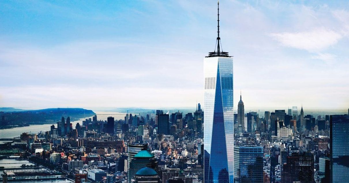 Wide aerial view of One World Trade Center and Lower Manhattan from above