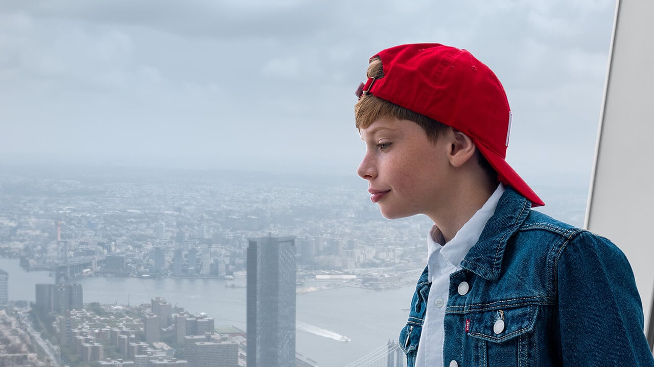 Visitor taking in panoramic views of Lower Manhattan