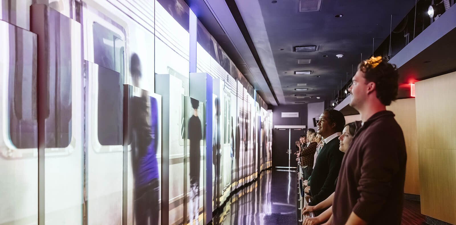 Guests experiencing an immersive presentation at One World Observatory