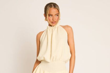 Cream textured flippy playsuit styled on a model for Rebellious Fashion