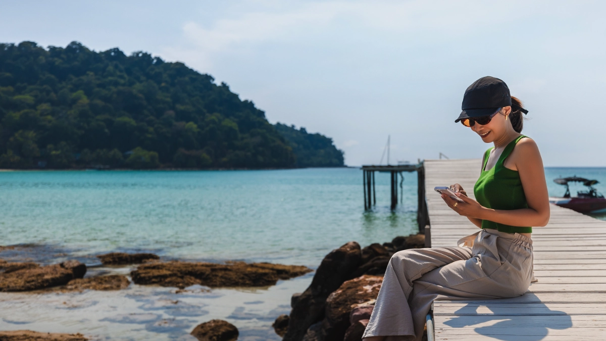 Traveller relaxing on a wooden pier in Thailand