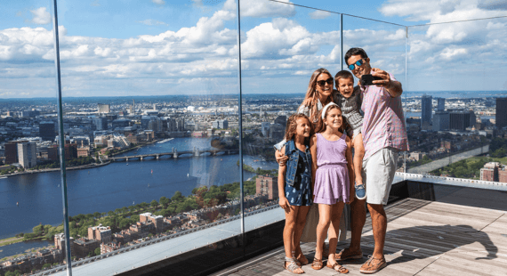 Family enjoying the outdoor deck at View Boston