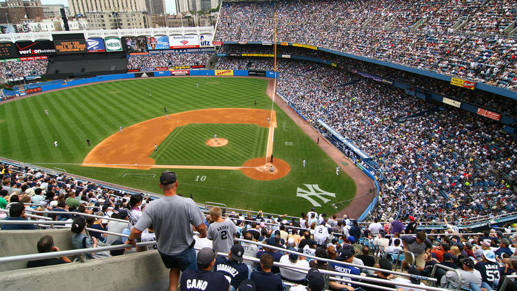 Fans watching a baseball game at Yankee Stadium