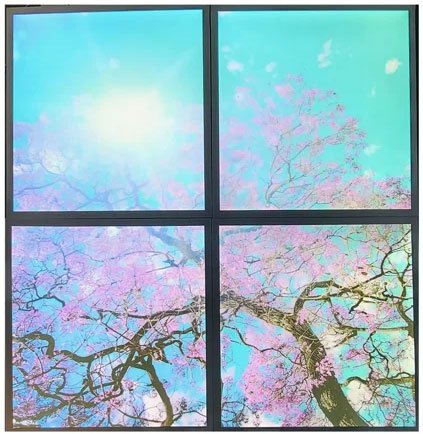 Decorative sky panel lighting with a tree scene