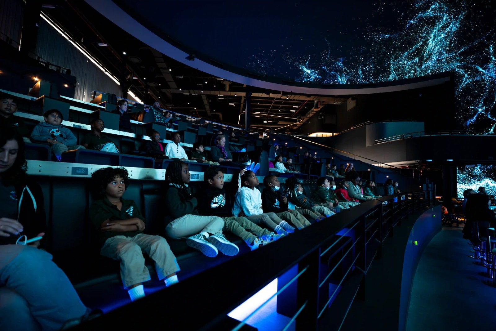 Visitors enjoying an immersive Cosm venue experience