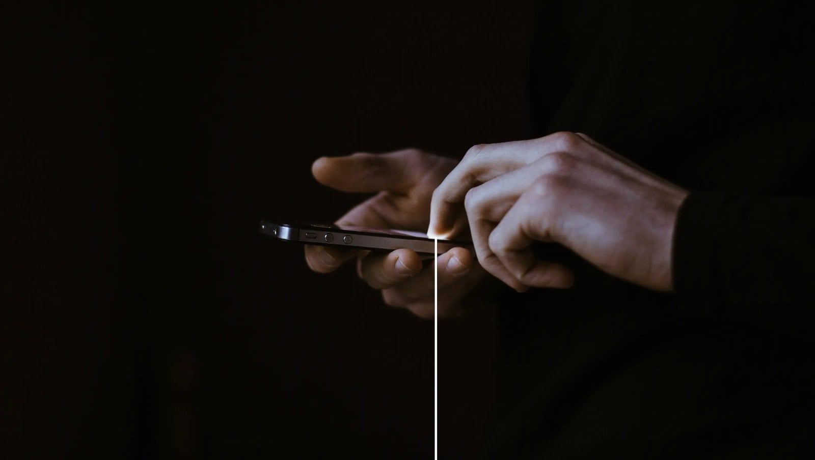 Hands using a phone at a Cosm venue