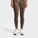 Model wearing leopard leggings