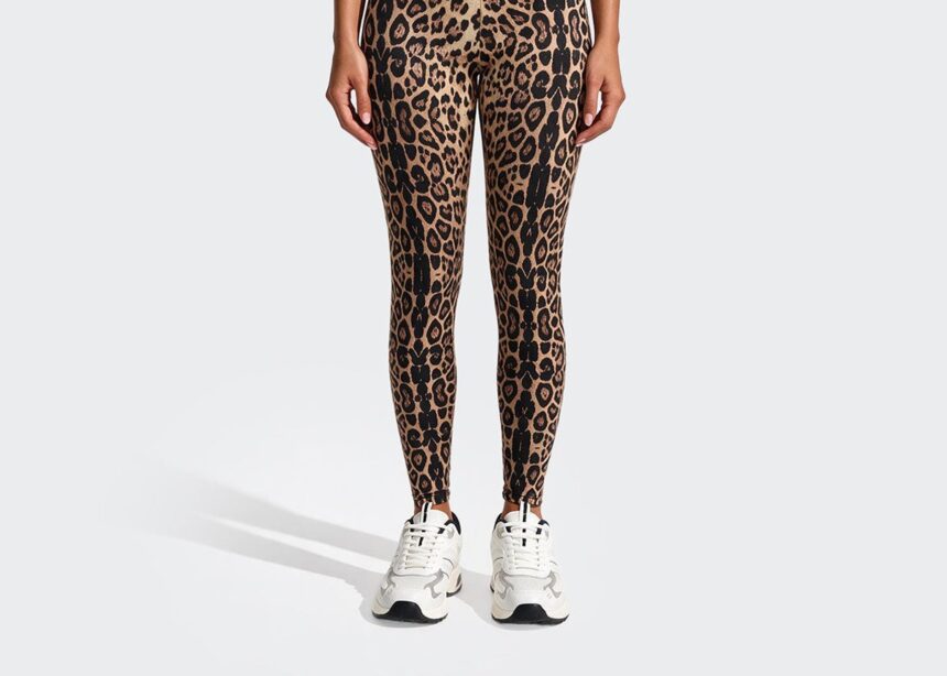 Model wearing leopard leggings