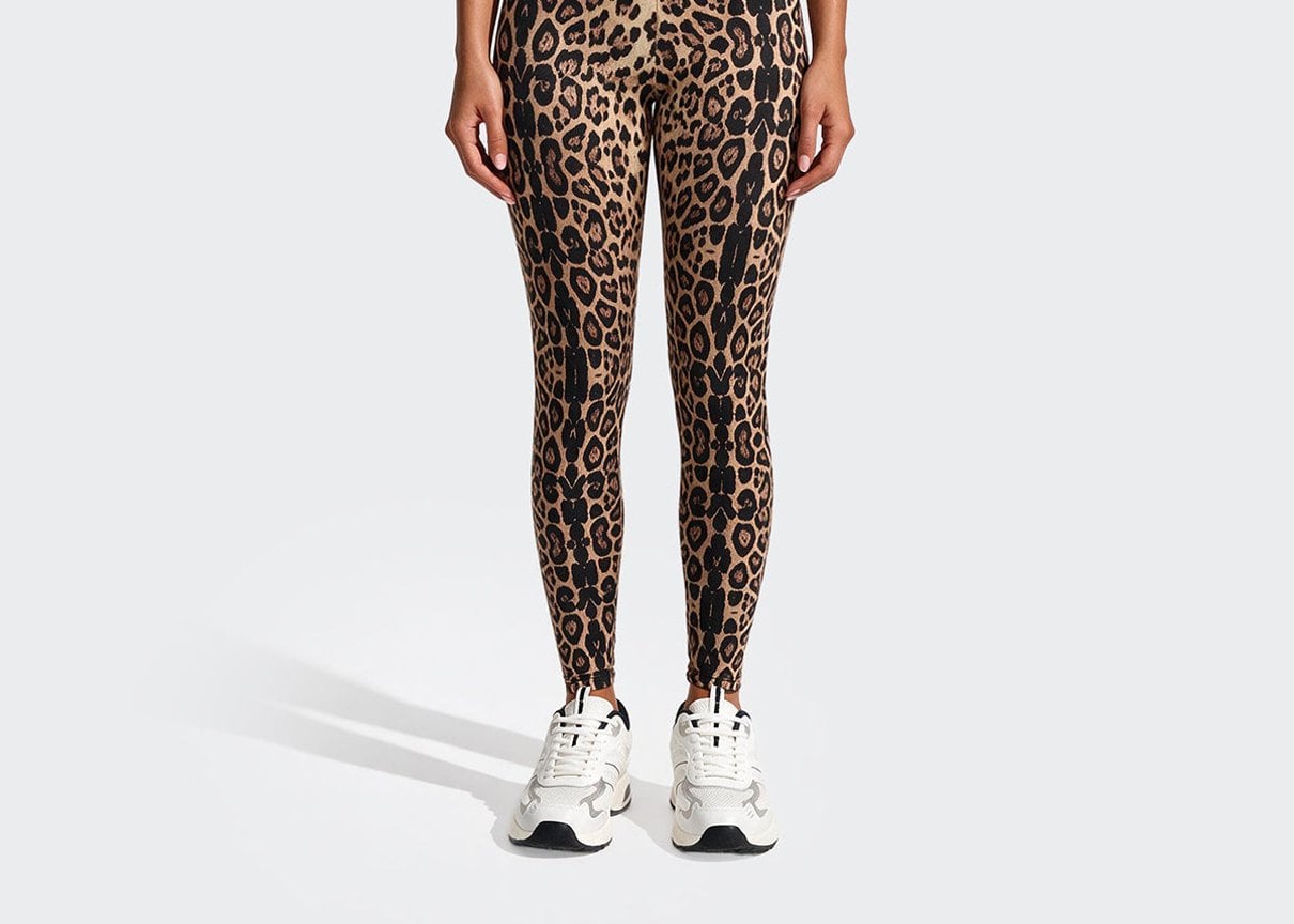 Model wearing leopard leggings
