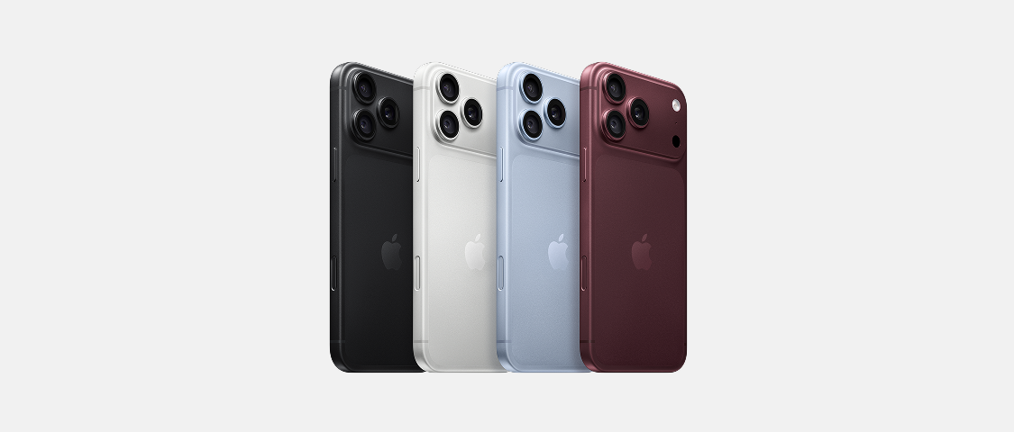 Vier Apple iPhone Pro Modelle in verschiedenen Farben
