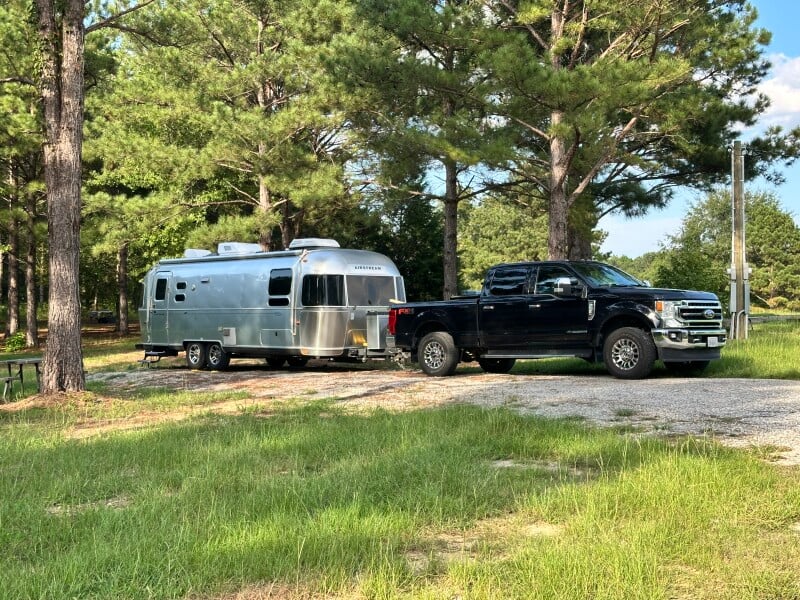 Truck towing an Airstream trailer outdoors