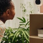 Nanit Flex Stand with camera in a nursery