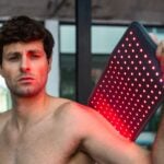 Person using the NOVAALAB LLC Light Pad on a shoulder