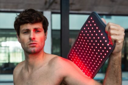 Person using the NOVAALAB LLC Light Pad on a shoulder