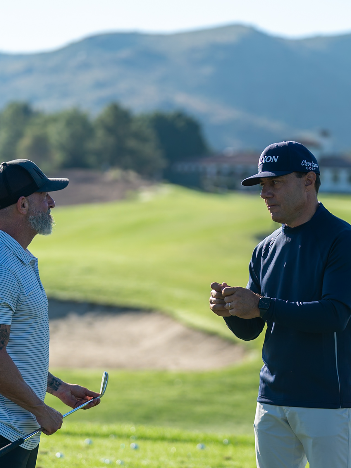 Golf coach demonstrating a practice movement