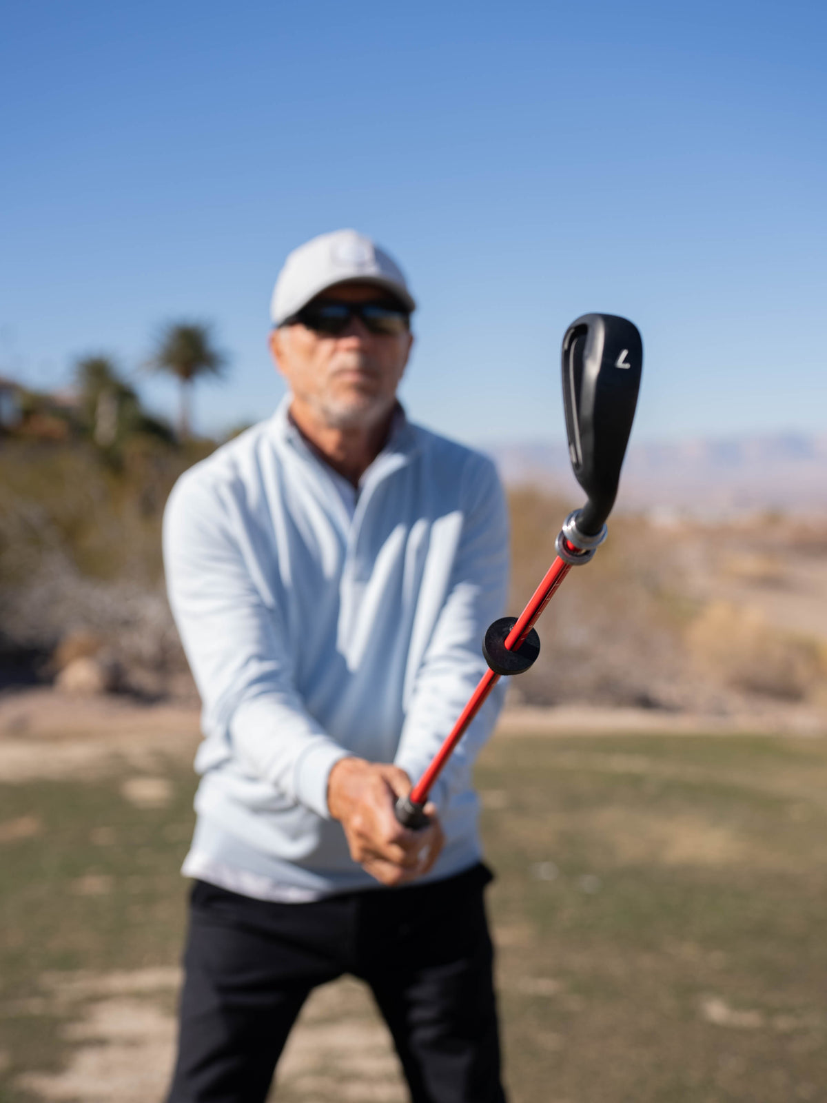 Golfer practicing at a driving range